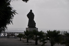 Monument of Diego Gomas looking out to sea in the morning hours.