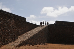 Rock ramp going from the dirt floor below to the top of the fortress.