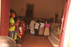 Walking by the side door of the church we previously had seen from above it looked like a baptism was taking place with the priest.