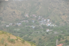 Homes scattered across the hillside.