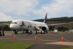 Latam, the airline of Chile. There is one flight a day. A 787 from Santiago to Hanga Rua, the main city, Easter Island. The locals call it Rapa Nui. The population as of 2017 is 7,750. Easter Island belongs to Chile. The languages are Spanish predominitely and the old Rapa Nui language.