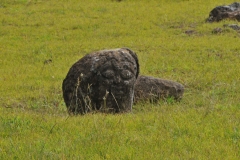 Carvings of a face into the stone