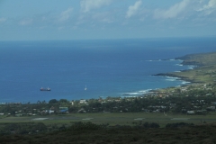 Airport in the foreground. Hanga Rua in the distance.  Notice there is no harbor or piers to bring supplies ashore.  Everything has to be barged in from ships off shore.