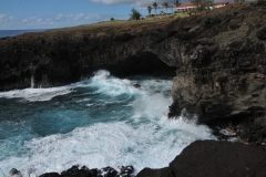 Ana Kai Tanata   A Legend Cave.  It is said to hold some cave paintings in the roof of the cave.  Also known as the Cave of the Cannibals. The hotel we were staying, Hotel Iorana is just above in the distance.