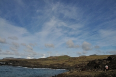 The legendary first paramount chief of Easter Island is said to have been Hotu Matu‘a, who supposedly arrived around 800 to 900 AD. Legend insists that this man was the chief of a tribe that lived on Marae Renga. The Marae Renga is said to have existed in a place known as the "Hiva region". Some books suggest that the Hiva region was an area in the Marquesas Islands, but today it is believed that the ancestral land of the Easter Islanders would have been located in the Pitcairn Mangareva intercultural zone. Some versions of the story claim that internal conflicts drove Hotu Matu‘a to sail with his tribe for new land, while others say a natural disaster, possibly a tidal wave, caused the tribe to flee.  Despite these differences, the stories do agree on the next part: A priest named Haumaka appeared to Hotu Matu‘a in his dreams one night. The priest flew out to sea and discovered an island which he called Te Pito ‘o te Kāinga, which means "the center of the earth". Sending seven scouts, Hotu Matu‘a embraced his dream and awaited the return of his scouts. After eating, planting yams, and resting, the seven scouts returned home to tell of the good news. Hotu Matu‘a took a large crew along with his family and everything they needed to survive in the new land. They then rowed a single huge double-hulled canoe to "the center of the earth" and landed at Anakena, Rapa Nui.