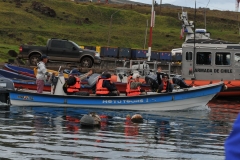 Groups left on two small boats to visit the islands that the Birdman swam to earlier in photos.