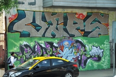 Great murals painted on the fronts and sides of buildings.