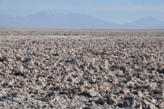 El Valle de la Luna (Valley of the Moon) is located 8 miles west of San Pedro de Atacama, to the north of Chile in the Cordillera de la Sal, in the Atacama desert. It has various stone and sand formations which have been carved by wind and water. It has an impressive range of color and texture, looking somewhat similar to the surface of the moon. There are also dry lakes where the composition of salt makes a white covering layer of the area. It presents diverse saline outcrops which appear like man-made sculptures