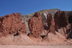 The colors are a kaleidoscopic palette of vibrant reds, purples, and yellows formed by the mineral deposits.