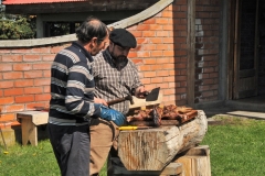 They are cutting the meat after breaking the ribs.