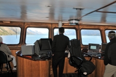 Inside the bridge of the Skorpios, the control center.