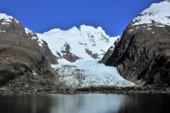 We are cruising on the Las Montanas Fjord, which threads between the Cordillera Sarmiento and the Cordillera Riesco mountain ranges.