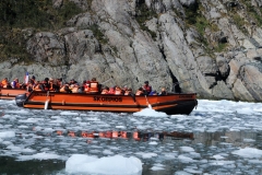 Cruising by smaller craft through the bay of Alsina Glacier.
