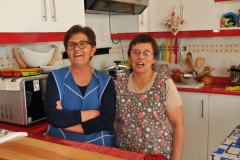 Mother and sister of the owner of the house helping prepare lunch for us.