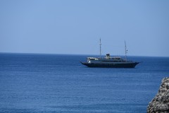 A tourist vessel passes in front of us.