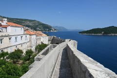 Walking the narrow walkway with homes to the left and the Adriatic Sea to the right.