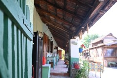 Looking down the outside walk with rooms to the left. 