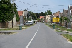 Looking down the street. Only a bicyclist on the road.