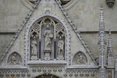 The finite work over the entrance of the Zagreb Cathedral. The beginnings of the construction of the Zagreb Cathedral date back to the 11th century when King Ladislav founded the Zagreb diocese. The cathedral was then built in the Romanesque-Gothic style, and after the great attack of the Tatars, it was rebuilt in the Gothic style. 