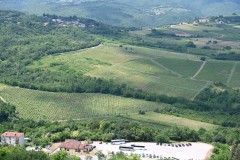 Beautiful view of crops and fields in every direction.  The parking lot below where we left the bus to pick up the smaller bus to the top of Motovun.