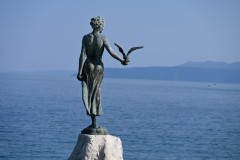 Another close up view of the statue in the harbor area of the Girl with a Seagull.