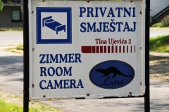 Sign advertising rooms for rent for visitors vacationing in the area. for her home.