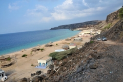 Hidden from the main land by a small mountain range, the beach stretches out along the coast, on one side, a rocky outcrop of the mainland protects the bay against the open sea, the color of the sea is turquoise, and a little further on, there are some smaller beaches as well.