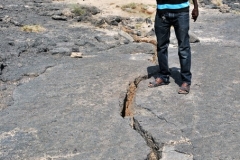Our local guide explaining how the ground is shifting and pulling in opposite directions.