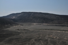 Road below driving across the face of the volcano crater floor.