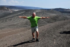 Upon reaching the summit, we saw the raw crust of the coastline in the distance, looking like burnt sponge cake.