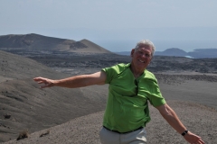 The wind was fierce at the top of the crater. At any minute a huge gust could blow you over the side.