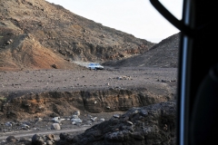 There are on no roads in this place on earth. Driving over open countryside, very foreboding and on rough terrain, in 4x4 land cruisers..