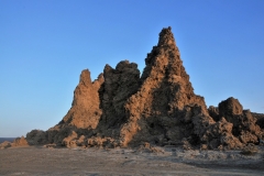 Situated in the middle of the hot and hellish Afar Depression, Lake Abbe stretches six miles in width and is covered in clusters of massive, steam-blasting limestone chimneys