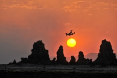 I was so pleased to be at the right place and exact moment to take this photo of the Osprey Tiltrotor Aircraft, half airplane and half helicopter, over the setting sun, and over the Chimneys in Djibouti.