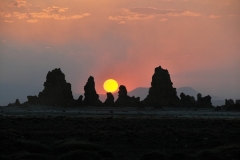 Perfect balancing of the sun and chimneys.