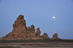 As the boiling water bubble up to the surface, they deposit the dissolved calcium carbonates creating towering chimneys, the same way water trickling down the roof of limestone caves create stalactites and stalagmites.