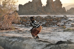 Young Afar boy out early in the morning. Notice the salt on the ground.