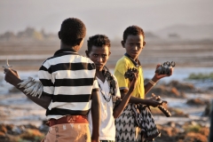 Young Afar looking for customers to buy their handiwork.