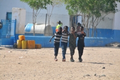 School was just breaking for lunch in a nearby larger village at noon as we passed through it.