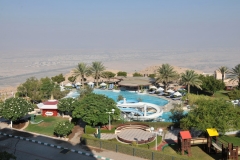 Hotel pool area and city below