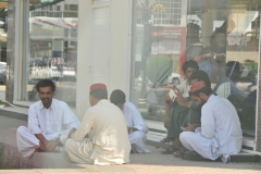 Men waiting for Mid day prayer to begin