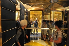 Having fun taking photos of the gold themed elevator and mirrors