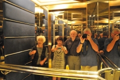 Taking photos of ourselves in the mirrors of the elevator as it is descending