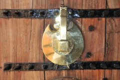 Ornate door knocker on the front door of the Museum