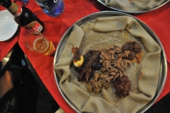 Ethiopian cuisine - local dish. This meal consisting of injera and several kinds of wat (stew) is typical of Ethiopian cuisine. Ethiopian cuisine characteristically consists of vegetable and often very spicy meat dishes. This is usually in the form of wat, a thick stew, served atop injera, a large .... It is often served as a side dish to soften the effect of very spicy food. Injera is a sourdough-risen flatbread with a unique, slightly spongy texture. Traditionally made out of teff flour, it is a national dish in Ethiopia a Type, Flatbread ... The injera is then ready to be baked into large, flat pancakes.