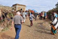 Entrance up the dirt road to the Babile Market