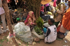 Woman selling Khat and a buyer. Local drug of choice.