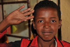 Young student saying goodbye to us