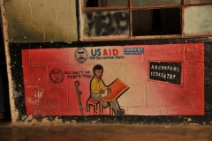 Interesting sign painted on the wall inside the school telling the students that they received US Aid from the American People.