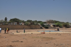 This is a dry riverbed alongside the market. When it rains it is a raging torrent to the sea.